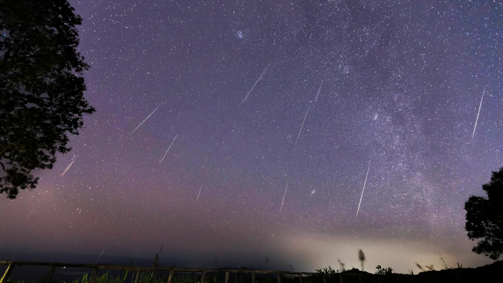 Geminid,Meteor,Shower,And,The,Milky,Way,Over,A,Mountain.
