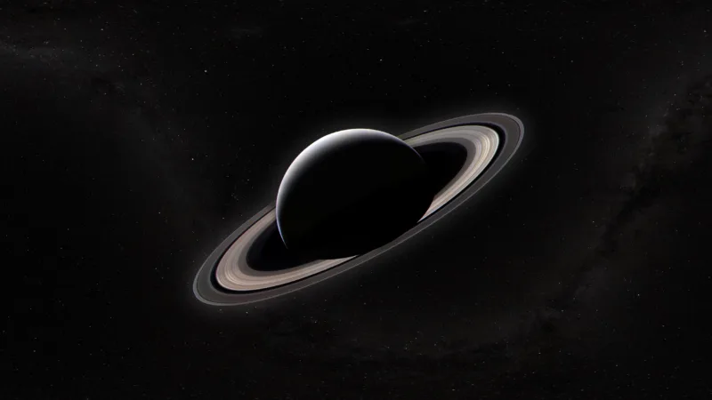 Saturn and its rings against the dark star field of space